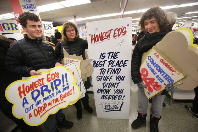 April 3, 2016 - Toronto, ON, Canada - TORONTO, ON - APRIL 3 - -Jennifer Greenwood with her son s Ethan(left) and Cooper hold up a signs that they want to buy at Honest Ed s hand painted sign sale. Toronto Canada  - ZUMAt14_