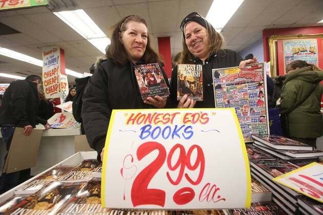 April 3, 2016 - Toronto, ON, Canada - TORONTO, ON - APRIL 3 - -Debbie Johnson(left) and Kris Moak hold up Honest Ed s books that they wants to buy at Honest Ed s hand painted sign sale. Toronto Canada  - ZUMAt14_