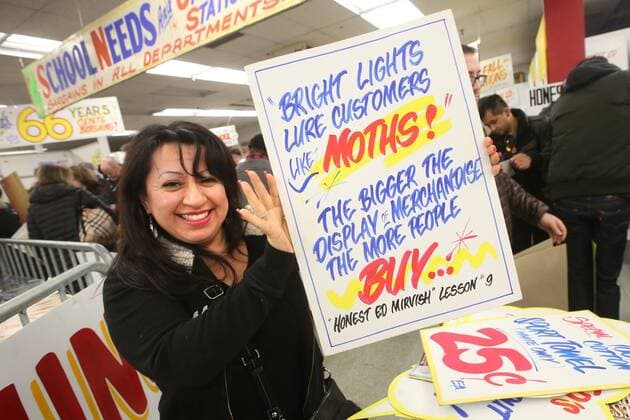 April 3, 2016 - Toronto, ON, Canada - TORONTO, ON - APRIL 3 - -Miriam Cadena holds up a sign that she wants to buy at Honest Ed s hand painted sign sale. Toronto Canada  - ZUMAt14_