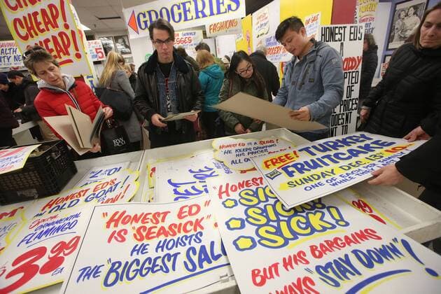 April 3, 2016 - Toronto, ON, Canada - TORONTO, ON - APRIL 3 - -Honest Ed goers look through piles of signs for purchase at Honest Ed s hand painted sign sale. Toronto Canada  - ZUMAt14_