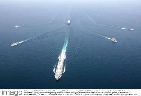 April 11, 2016 - Gulf Of Oman, Oman - Navy ships led by the HMS Defender and Royal Fleet Auxiliary ship RFA Cardigan Bay anchor a formation during International Mine Countermeasures Exercises April 11, 2016 near the Straits of Hormuz. IMCMEX includes navies from 44 countries whose focus is to promote regional security through mine countermeasure operations. Gulf Of Oman Oman - ZUMAp138