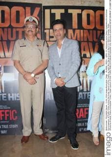 MUMBAI, INDIA - APRIL 13: Bollywood actor Manoj Vajpayee with Additional Commissioner of Traffic Police during the trailer launch of film Traffic at Light Box, Santa Cruz on April 13, 2016 in Mumbai, India. (Photo by Pramod Thakur Hindustan Times) Trailer Launch Of Film Traffic