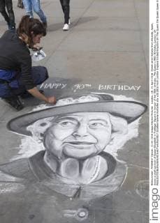 London, UK. 21 April 2016. Street artist Natalia from Alicante, Spain, draws a chalk portrait of Queen Elizabeth in Trafalgar Square in honour of her 90th birthday. The Queen s 90th Birthday, London, UK 