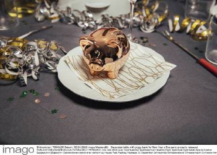 Decorated table with piggy bank for New Year s Eve party property released  MFF002921
