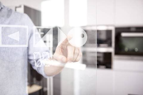 Man s hand using touchscreen of oven in his kitchen model released Symbolfoto property released  MFRF000545
