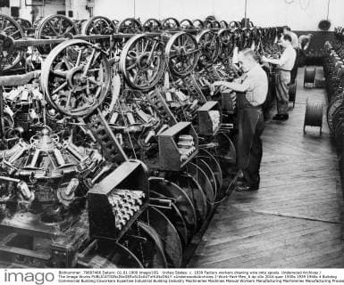 Unites States: c. 1939 Factory workers drawing wire onto spools. Underwood Archives The Image Works xUnderwoodxArchives 1-Work-Fact-Men_6