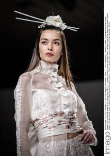 April 27, 2016 - Barcelona, Catalonia, Spain - A model walks the runway presenting a wedding dress of the Spring Summer 2017 collection during the Inmaculada Garcia catwalk show at the Barcelona Bridal Fashion Week 2016 Barcelona Spain - ZUMAo105