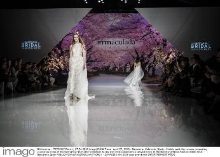 April 27, 2016 - Barcelona, Catalonia, Spain - Models walk the runway presenting a wedding dress of the Spring Summer 2017 collection during the Inmaculada Garcia catwalk show at the Barcelona Bridal Fashion Week 2016 Barcelona Spain - ZUMAo105