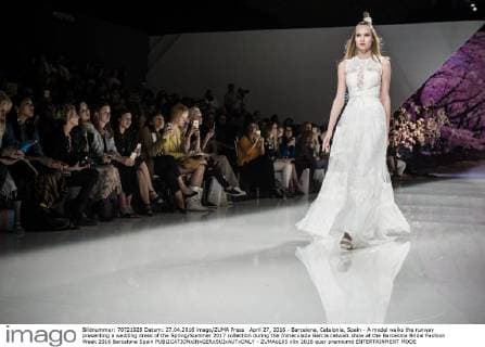 April 27, 2016 - Barcelona, Catalonia, Spain - A model walks the runway presenting a wedding dress of the Spring Summer 2017 collection during the Inmaculada Garcia catwalk show at the Barcelona Bridal Fashion Week 2016 Barcelona Spain - ZUMAo105