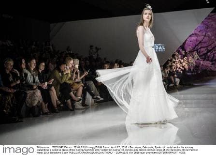 April 27, 2016 - Barcelona, Catalonia, Spain - A model walks the runway presenting a wedding dress of the Spring Summer 2017 collection during the Inmaculada Garcia catwalk show at the Barcelona Bridal Fashion Week 2016 Barcelona Spain - ZUMAo105