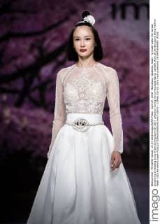 April 27, 2016 - Barcelona, Catalonia, Spain - A model walks the runway presenting a wedding dress of the Spring Summer 2017 collection during the Inmaculada Garcia catwalk show at the Barcelona Bridal Fashion Week 2016 Barcelona Spain - ZUMAo105