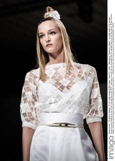 April 27, 2016 - Barcelona, Catalonia, Spain - A model walks the runway presenting a wedding dress of the Spring Summer 2017 collection during the Inmaculada Garcia catwalk show at the Barcelona Bridal Fashion Week 2016 Barcelona Spain - ZUMAo105