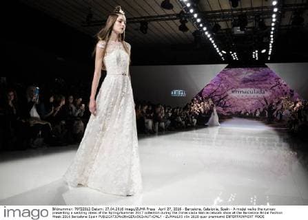 April 27, 2016 - Barcelona, Catalonia, Spain - A model walks the runway presenting a wedding dress of the Spring Summer 2017 collection during the Inmaculada Garcia catwalk show at the Barcelona Bridal Fashion Week 2016 Barcelona Spain - ZUMAo105