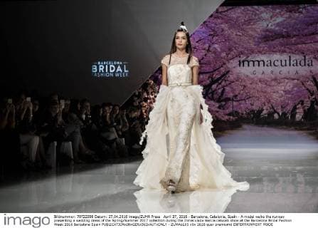 April 27, 2016 - Barcelona, Catalonia, Spain - A model walks the runway presenting a wedding dress of the Spring Summer 2017 collection during the Inmaculada Garcia catwalk show at the Barcelona Bridal Fashion Week 2016 Barcelona Spain - ZUMAo105