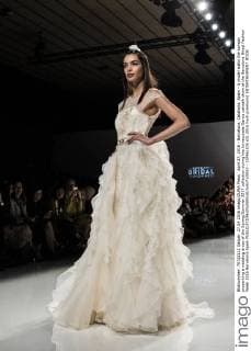 April 27, 2016 - Barcelona, Catalonia, Spain - A model walks the runway presenting a wedding dress of the Spring Summer 2017 collection during the Inmaculada Garcia catwalk show at the Barcelona Bridal Fashion Week 2016 Barcelona Spain - ZUMAo105