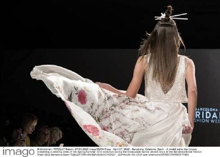 April 27, 2016 - Barcelona, Catalonia, Spain - A model walks the runway presenting a wedding dress of the Spring Summer 2017 collection during the Inmaculada Garcia catwalk show at the Barcelona Bridal Fashion Week 2016 Barcelona Spain - ZUMAo105