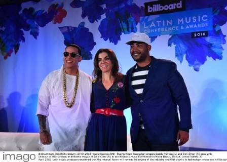 Puerto Rican Reaggeton singers Daddy Yankee (L) and Don Omar (R) pose with Director of latin content at Billboard Magazine Leila Cobo (R) at the Billboard Music Conference in Miami Beach, Florida, United States, 27 April 2016. Latin music producers explained that the musical fusion will remain the engine of the industry and that thanks to technology innovation will be quicker and more successful. EFE Gaston de Cardenas MUSIC PRODUCERS AFFIRM THE ADVANCES OF TECHNOLOGY WIL WALLOW INNOVATION !ACHTUNG: NUR REDAKTIONELLE NUTZUNG!  MBE011 20160428-635974085720125658