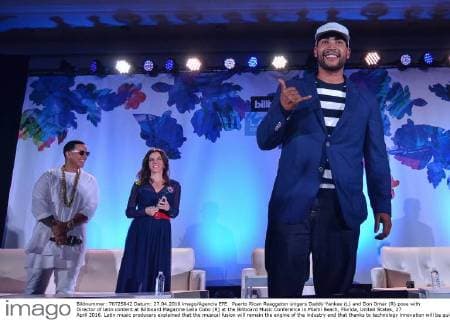 Puerto Rican Reaggeton singers Daddy Yankee (L) and Don Omar (R) pose with Director of latin content at Billboard Magazine Leila Cobo (R) at the Billboard Music Conference in Miami Beach, Florida, United States, 27 April 2016. Latin music producers explained that the musical fusion will remain the engine of the industry and that thanks to technology innovation will be quicker and more successful. EFE Gaston de Cardenas MUSIC PRODUCERS AFFIRM THE ADVANCES OF TECHNOLOGY WIL WALLOW INNOVATION !ACHTUNG: NUR REDAKTIONELLE NUTZUNG!  MBE013 20160428-635974088363857658