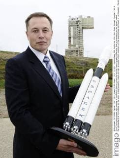 JULY 13,2011 - Vandenberg AFB, California, USA. Elon Musk, SpaceX Founder, CEO & Chief Technology poses with a model of the Falcon Heavy rocket during the SpaceX press confernece that is renovating an old launch pad at the Vandenberg Air Force Base for the world s most powerful rocket during a groundbreaking ceremony at the seaside base northwest of Los Angeles...The Hawthorne-based company is building the Falcon Heavy designed to be large enough to send cargo or even people beyond Earth s orbit. Only the retired Saturn V rocket that ferried astronauts to the moon was bigger. - ZUMAbl1_