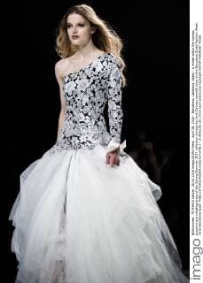 April 28, 2016 - Barcelona, Catalonia, Spain - A model walks the runway presenting a wedding dress of the Spring Summer 2017 collection during the Jordi Dalmau catwalk show at the Barcelona Bridal Fashion Week 2016 Barcelona Spain - ZUMAo105