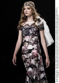 April 28, 2016 - Barcelona, Catalonia, Spain - A model walks the runway presenting a wedding dress of the Spring Summer 2017 collection during the Matilde Cano catwalk show at the Barcelona Bridal Fashion Week 2016 Barcelona Spain - ZUMAo105