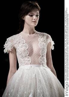 April 28, 2016 - Barcelona, Catalonia, Spain - A model walks the runway presenting a wedding dress of the Spring Summer 2017 collection during the Marco & Maria M&M catwalk show at the Barcelona Bridal Fashion Week 2016 Barcelona Spain - ZUMAo105