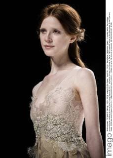 April 28, 2016 - Barcelona, Catalonia, Spain - A model walks the runway presenting a wedding dress of the Spring Summer 2017 collection during the Marco & Maria M&M catwalk show at the Barcelona Bridal Fashion Week 2016 Barcelona Spain - ZUMAo105