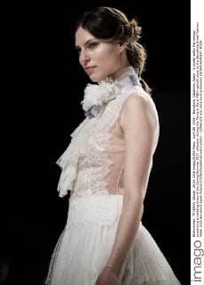 April 28, 2016 - Barcelona, Catalonia, Spain - A model walks the runway presenting a wedding dress of the Spring Summer 2017 collection during the Marco & Maria M&M catwalk show at the Barcelona Bridal Fashion Week 2016 Barcelona Spain - ZUMAo105