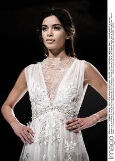 April 28, 2016 - Barcelona, Catalonia, Spain - A model walks the runway presenting a wedding dress of the Spring Summer 2017 collection during the Marco & Maria M&M catwalk show at the Barcelona Bridal Fashion Week 2016 Barcelona Spain - ZUMAo105
