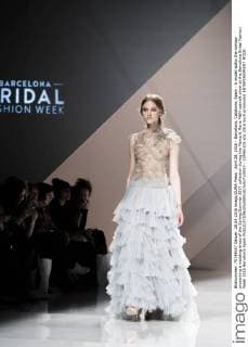 April 28, 2016 - Barcelona, Catalonia, Spain - A model walks the runway presenting a wedding dress of the Spring Summer 2017 collection during the Marco & Maria M&M catwalk show at the Barcelona Bridal Fashion Week 2016 Barcelona Spain - ZUMAo105