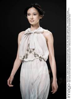 April 28, 2016 - Barcelona, Catalonia, Spain - A model walks the runway presenting a wedding dress of the Spring Summer 2017 collection during the Marco & Maria M&M catwalk show at the Barcelona Bridal Fashion Week 2016 Barcelona Spain - ZUMAo105