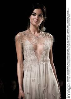 April 28, 2016 - Barcelona, Catalonia, Spain - A model walks the runway presenting a wedding dress of the Spring Summer 2017 collection during the Marco & Maria M&M catwalk show at the Barcelona Bridal Fashion Week 2016 Barcelona Spain - ZUMAo105
