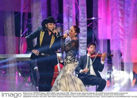 Mexican singer Alejandra Guzman (C) and US Gerardo Ortiz perform during the ceremony of the Latin Music Billboard Awards at the BankUnited Center in Coral Gables, Florida, United States, 28 April 2016. LATIN MUSIC BILLBOARD AWARDS !ACHTUNG: NUR REDAKTIONELLE NUTZUNG!  CGS043 20160429-635974989618159057