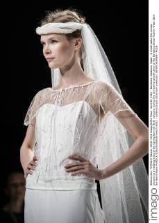 April 29, 2016 - Barcelona, Catalonia, Spain - A model walks the runway presenting a wedding dress of the Spring Summer 2017 collection during the Cymbeline catwalk show at the Barcelona Bridal Fashion Week 2016 Barcelona Spain - ZUMAo105