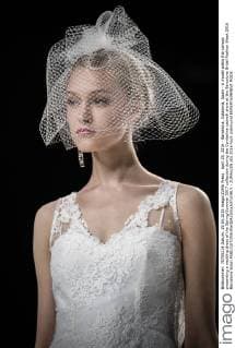 April 29, 2016 - Barcelona, Catalonia, Spain - A model walks the runway presenting a wedding dress of the Spring Summer 2017 collection during the Cymbeline catwalk show at the Barcelona Bridal Fashion Week 2016 Barcelona Spain - ZUMAo105