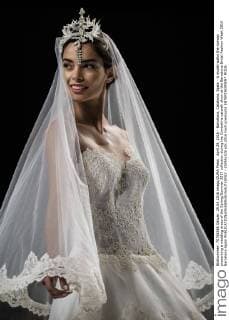 April 29, 2016 - Barcelona, Catalonia, Spain - A model walks the runway presenting a wedding dress of the Spring Summer 2017 collection during the Cymbeline catwalk show at the Barcelona Bridal Fashion Week 2016 Barcelona Spain - ZUMAo105
