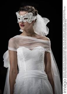April 29, 2016 - Barcelona, Catalonia, Spain - A model walks the runway presenting a wedding dress of the Spring Summer 2017 collection during the Cymbeline catwalk show at the Barcelona Bridal Fashion Week 2016 Barcelona Spain - ZUMAo105