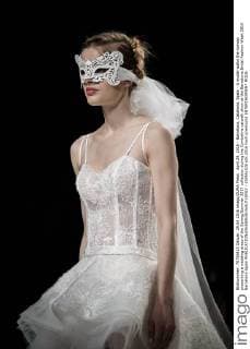 April 29, 2016 - Barcelona, Catalonia, Spain - A model walks the runway presenting a wedding dress of the Spring Summer 2017 collection during the Cymbeline catwalk show at the Barcelona Bridal Fashion Week 2016 Barcelona Spain - ZUMAo105