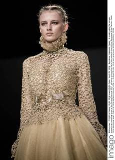 April 29, 2016 - Barcelona, Catalonia, Spain - A model walks the runway presenting a wedding dress of the Spring Summer 2017 collection during the Carla Ruiz catwalk show at the Barcelona Bridal Fashion Week 2016 Barcelona Spain - ZUMAo105