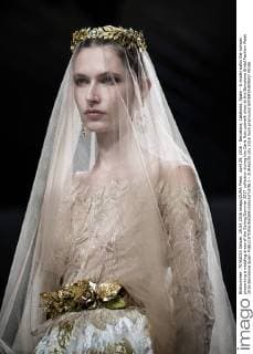 April 29, 2016 - Barcelona, Catalonia, Spain - A model walks the runway presenting a wedding dress of the Spring Summer 2017 collection during the Carla Ruiz catwalk show at the Barcelona Bridal Fashion Week 2016 Barcelona Spain - ZUMAo105