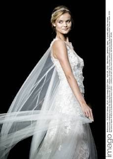 April 29, 2016 - Barcelona, Catalonia, Spain - A model walks the runway presenting a wedding dress of the Spring Summer 2017 collection during the Pronovias catwalk show at the Barcelona Bridal Fashion Week 2016 Barcelona Spain - ZUMAo105