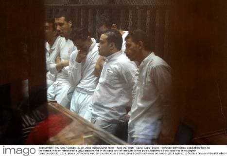 April 30, 2016 - Cairo, Cairo, Egypt - Egyptian defendants wait behind bars for the verdict in their retrial over a 2012 stadium riot in the canal city of Port Said at the police academy on the outskirts of the capital Cairo on April 30, 2016. Seven defendants wait for the verdict as a court upheld death sentences on June 9, 2015 against 11 football fans over the riot which broke out when fans of home team Al-Masry and Cairo s Al-Ahly clashed after a premier league match between the two clubs, leaving 74 people dead on May 30, 2015 Cairo Egypt - ZUMAap3_