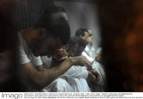 April 30, 2016 - Cairo, Cairo, Egypt - Egyptian defendants wait behind bars for the verdict in their retrial over a 2012 stadium riot in the canal city of Port Said at the police academy on the outskirts of the capital Cairo on April 30, 2016. Seven defendants wait for the verdict as a court upheld death sentences on June 9, 2015 against 11 football fans over the riot which broke out when fans of home team Al-Masry and Cairo s Al-Ahly clashed after a premier league match between the two clubs, leaving 74 people dead on May 30, 2015 Cairo Egypt - ZUMAap3_