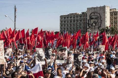 (160501) -- HAVANA, May 1, 2016 -- Cubans and foreign guests parade in Revolutionary Square in Havana, Cuba, on May 1, 2016. More the 500, 000 locals and foreigners took part in Cuba s International Workers Day parade here on Sunday, also celebrating the 90th birthday of Cuban revolutionary leader Fidel Castro. ) (jp) CUBA-HAVANA-MAY DAY-PARADE JOAQUINxHERNANDEZ 