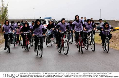 (160502) -- HERAT, May 2, 2016 -- An Afghan women cyclist team compete to win the competition during a cycle event in Herat province, Afghanistan, May 2, 2016. Some 25 female cyclists took part in a cycling competition in Herat province, west of Afghanistan to demonstrate against gender discrimination. ) AFGHANISTAN-HERAT-FEMALE CYCLIST COMPETITION NasimxSeyamak 