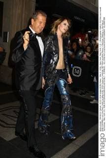 May 2, 2016 - New York, New York, U.S. - Photographer MARIO TESTINO and model EDIE CAMPBELL exit the Mark Hotel, to attend the 2016 Costume Institute MET GALA entitled Manus x Machina: Fashion in the Age of Technology. New York U.S. - ZUMAk03_