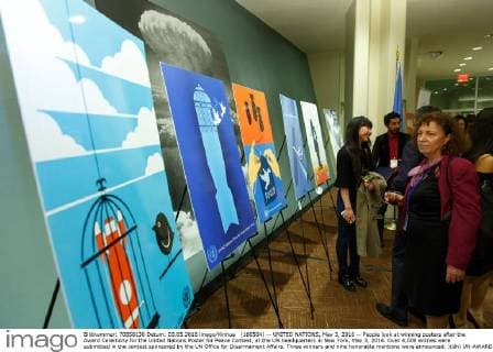 (160504) -- UNITED NATIONS, May 3, 2016 -- People look at winning posters after the Award Ceremony for the United Nations Poster for Peace Contest, at the UN headquarters in New York, May 3, 2016. Over 4,000 entries were submitted in the contest sponsored by the UN Office for Disarmament Affairs. Three winners and nine honorable mentions were announced. )(dh) UN-AWARD CEREMONY FOR THE UN POSTER FOR PEACE CONTEST LixMuzi 
