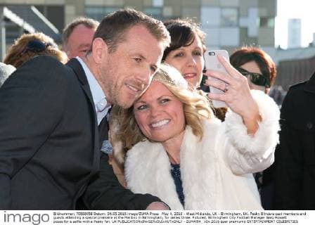 May 4, 2016 - West Midlands, UK - Birmingham, UK. Peaky Blinders cast members and guests attending a special premiere at the Mailbox in Birmingham, for series three. Pictured, Birmingham City Football Manager Gary Rowett poses for a selfie with a Peaky fan. UK  - ZUMAl94_