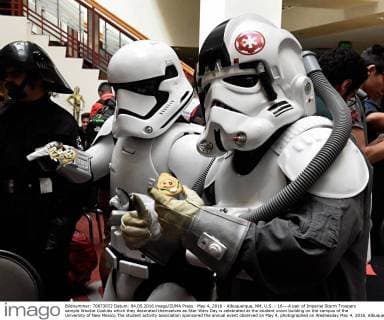 May 4, 2016 - Albuquerque, NM, U.S. - 16---A pair of Imperial Storm Troopers sample Wookie Cookies which they decorated themselves as Star Wars Day is celebrated at the student union building on the campus of the University of New Mexico.The student activity association sponsored the annual event observed on May 4, photographed on Wednesday May 4, 2016. Albuquerque U.S. - ZUMAab1_