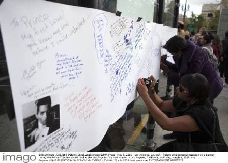 May 6, 2016 - Los Angeles, CA, USA - People sing personal message on a banner during the Prince Tribute concert held at the Los Angeles City Hall located in Los Angeles, California, on Friday, March 6, 2016. Los Angeles USA - ZUMAh129